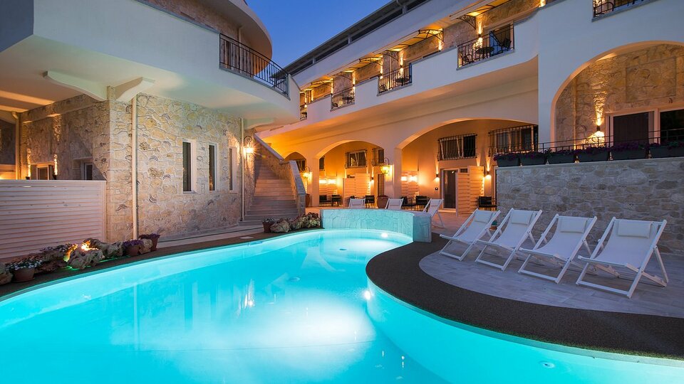 Neikos Mediterraneo Luxury Suites logo